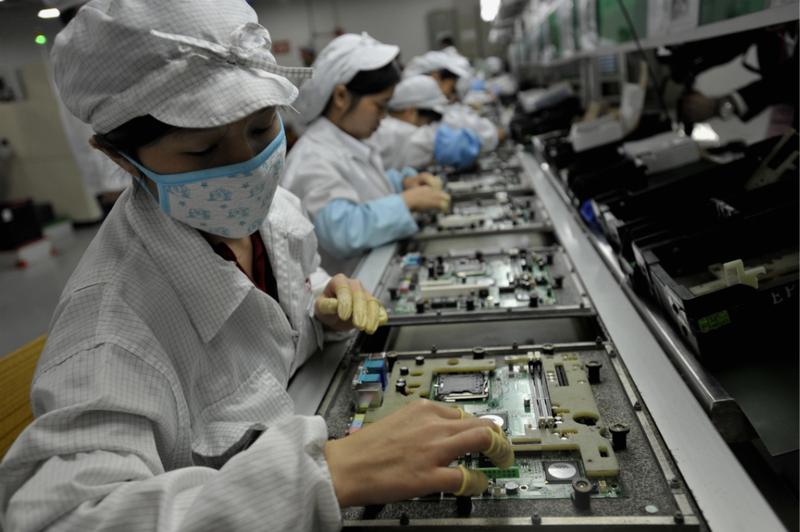 Chinese workers assemble electronic components at the Taiwanese technology giant Foxconn's factory in Shenzhen.